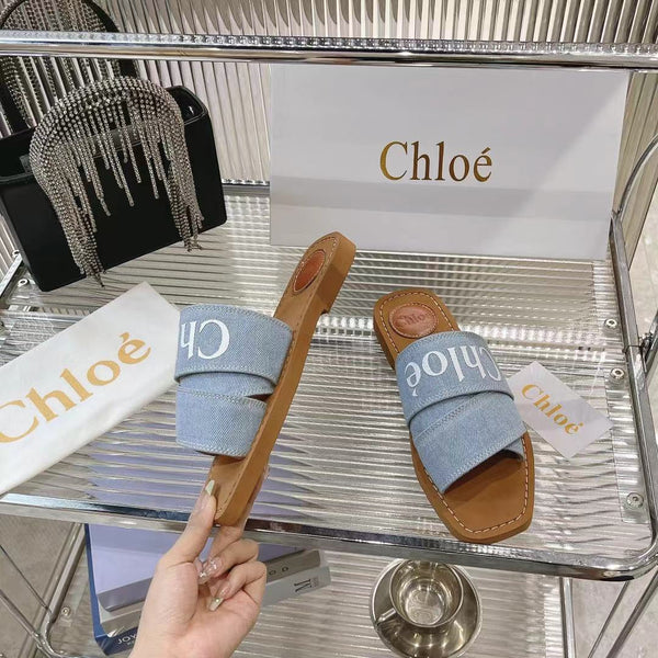 CHLOÉ WOODY MULE IN LIGHT BLUE DENIM WITH WHITE LOGO