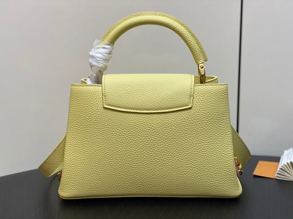 capucines mm 31.5 yellow taurillon leather gold hardware