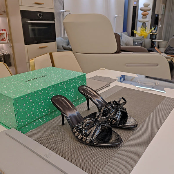 MULES ALTE IN PELLE DI MONTONE NERA CON FIOCCO