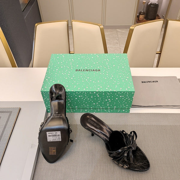 MULES ALTE IN PELLE DI MONTONE NERA CON FIOCCO