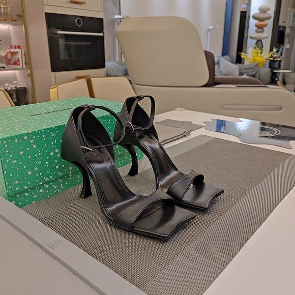 OPEN-TOE CURVED HIGH HEEL SANDALS IN BLACK SMOOTH CALFSKIN