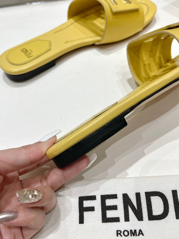 FENDI BAGUETTE SLIDES IN BRIGHT YELLOW LAMBSKIN