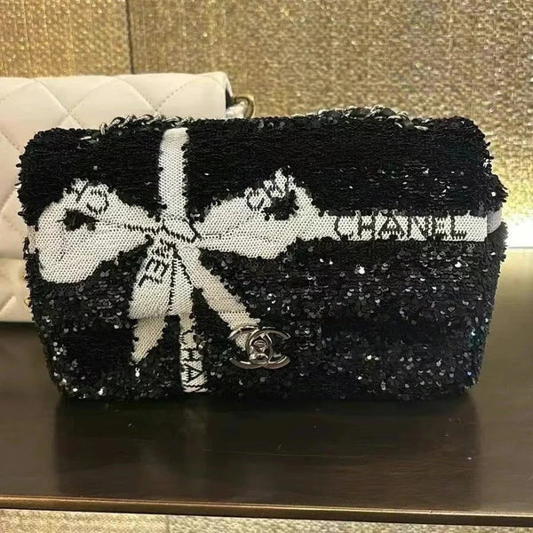 CC 25S FLAP BAG 20 CM IN BLACK SEQUINS WITH WHITE BOW
