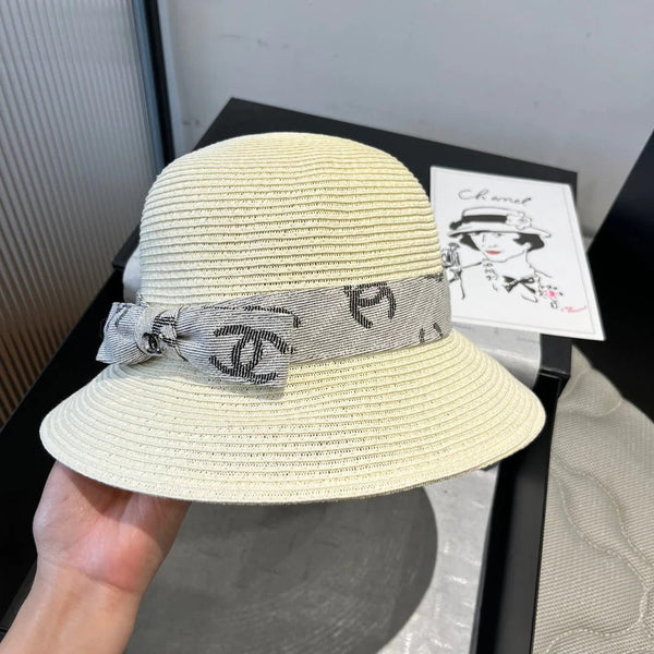 STRAW BUCKET HAT IN IVORY WITH RIBBON BOW 673977