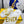 FENDI GRAPHY LOGO LETTERING SLIDES IN WHITE LAMBSKIN WITH GOLD HARDWARE