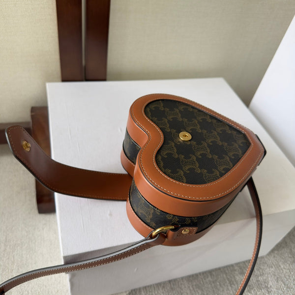 HEART TAMBOUR BAG 15 IN BLACK TRIOMPHE CANVAS AND BRONZE BROWN CALFSKIN