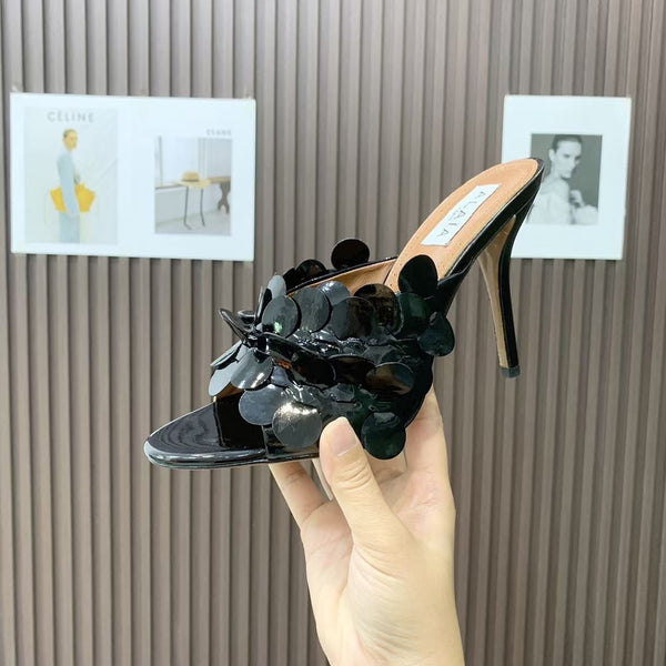 Mules in pelle Alaia Confetti in pelle di pecora nera lucida 293163