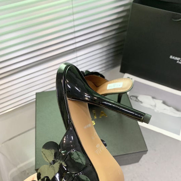 Mules in pelle Alaia Confetti in pelle di pecora nera lucida 293163