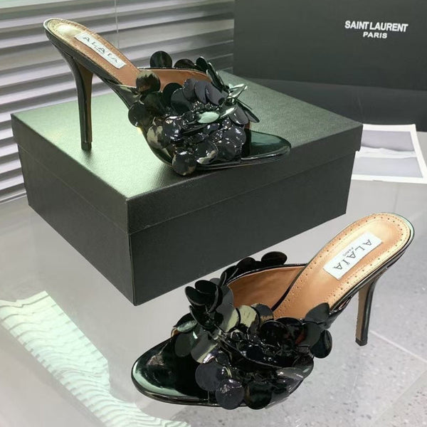 Mules in pelle Alaia Confetti in pelle di pecora nera lucida 293163