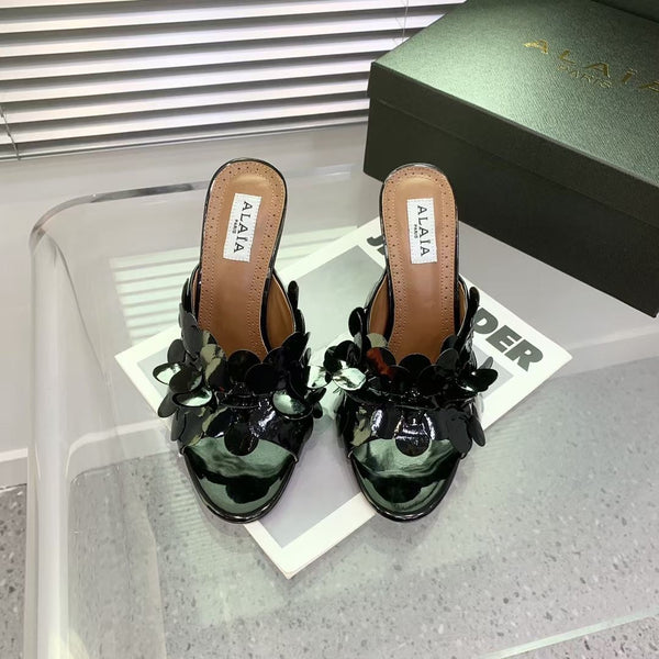 Mules in pelle Alaia Confetti in pelle di pecora nera lucida 293163