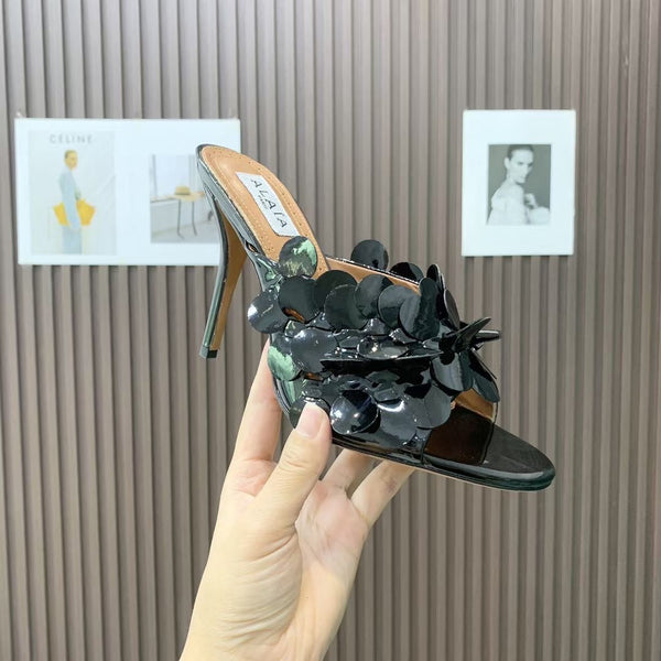 Mules in pelle Alaia Confetti in pelle di pecora nera lucida 293163