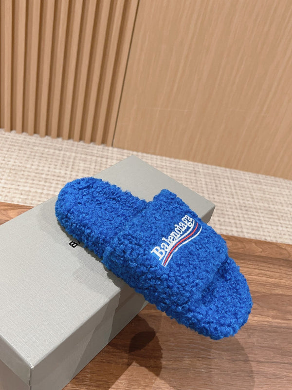 FURRY SLIDES IN COBALT BLUE CURLY SHEARLING
