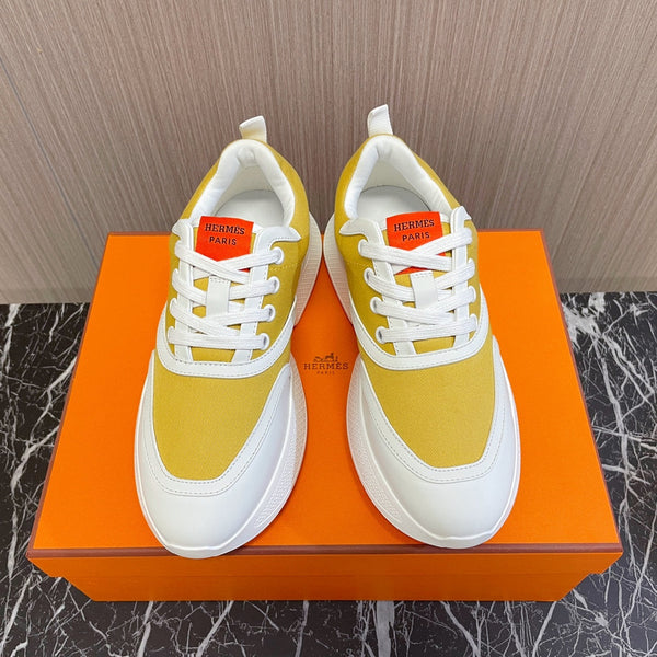 Sneaker HM Giga 50 in tela giallo sole, pelle di capra bianca e arancione