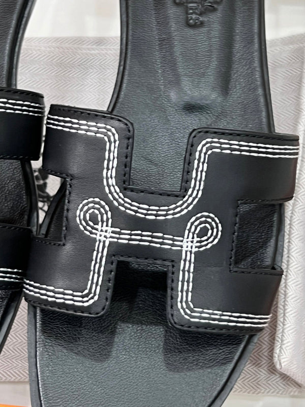 0ran sandal black white epsom