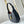 LOW KEY SHOULDER BAG 26 IN BLACK GRAINED CALFSKIN GOLD BUCKLE