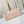 BORSA CARRYALL 29 IN PELLE CON STAMPA MONOGRAMMA ROSA CHIARO