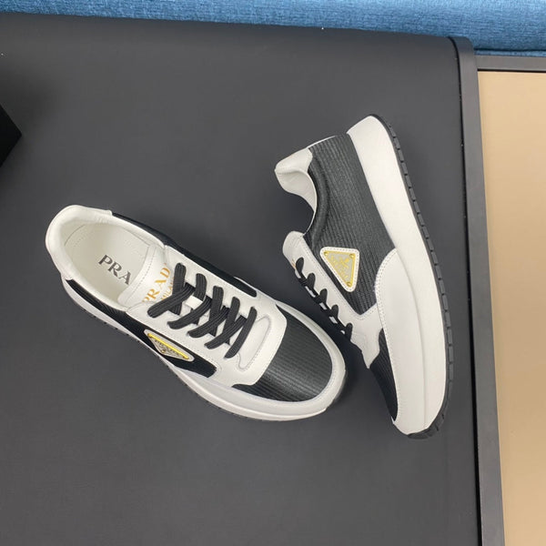 PRA SNEAKER IN WHITE CALFSKIN AND BLACK FABRIC WITH GOLDEN LOGO