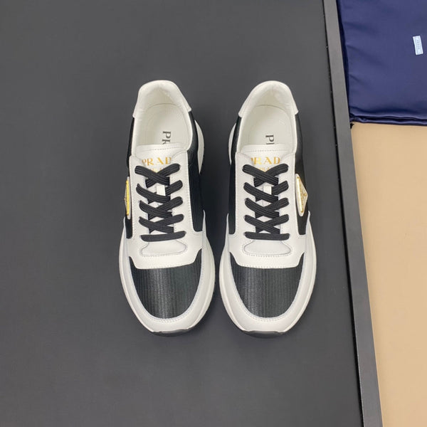 PRA SNEAKER IN WHITE CALFSKIN AND BLACK FABRIC WITH GOLDEN LOGO