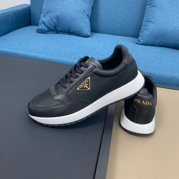 PRA SNEAKER IN BLACK CALFSKIN AND FABRIC WITH GOLDEN LOGO