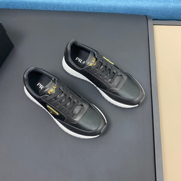 PRA SNEAKER IN BLACK CALFSKIN AND FABRIC WITH GOLDEN LOGO