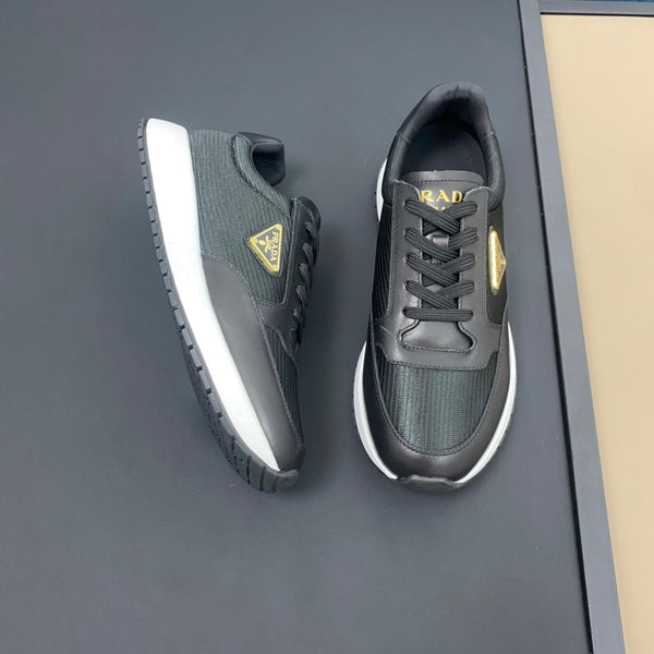 PRA SNEAKER IN BLACK CALFSKIN AND FABRIC WITH GOLDEN LOGO