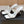 ALAIA TWO-STRAPS HIGH HEEL SANDALS IN WHITE PATENT LAMBSKIN