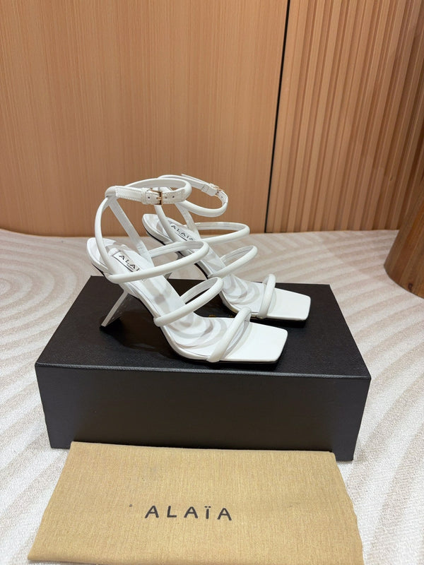 ALAIA THREE-STRAPS HIGH HEEL SANDALS IN WHITE PATENT LAMBSKIN