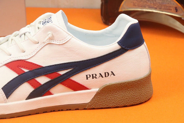 PRA SNEAKER IN WHITE CALFSKIN WITH NAVY BLUE AND RED STRIPED