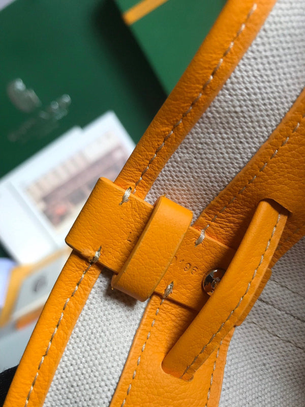 PETIT FLOT BUCKET BAG 22 IN YELLOW GOYARDINE CANVAS AND LAMBSKIN TRIM