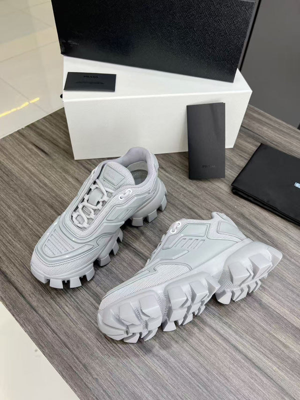 Sneakers Prada Cloudbust Thunder in tessuto lavorato a maglia bianco misto grigio perla