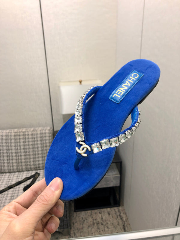 THONG SLIDE IN COBALT BLUE SUEDE WITH WHITE CRYSTALS