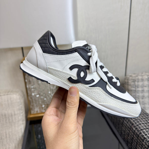 Chanel 2025 Sneaker Black and White Cowhite & Suede 507456