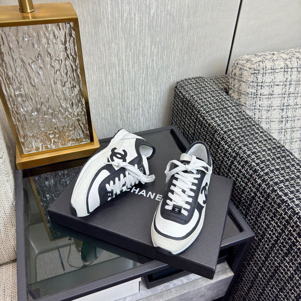 Chanel 2025 Sneaker Black and White Cowhite & Suede 507456