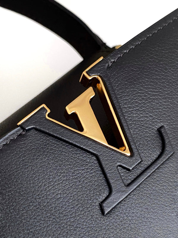 CAPUCINES GM 33CM BLACK GOLD TAURILLON LEATHER 252021