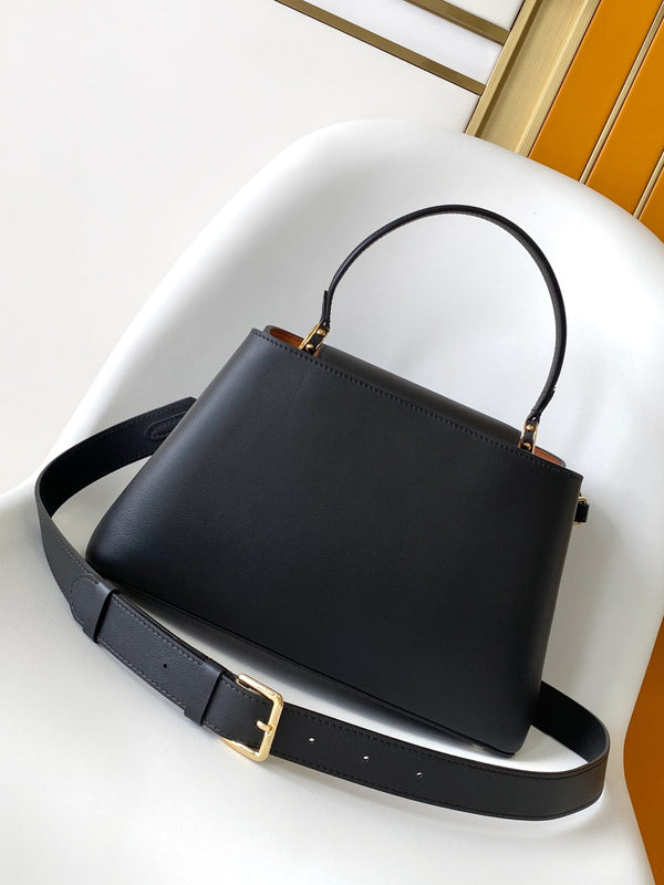 CAPUCINES GM 33CM BLACK GOLD TAURILLON LEATHER 252021