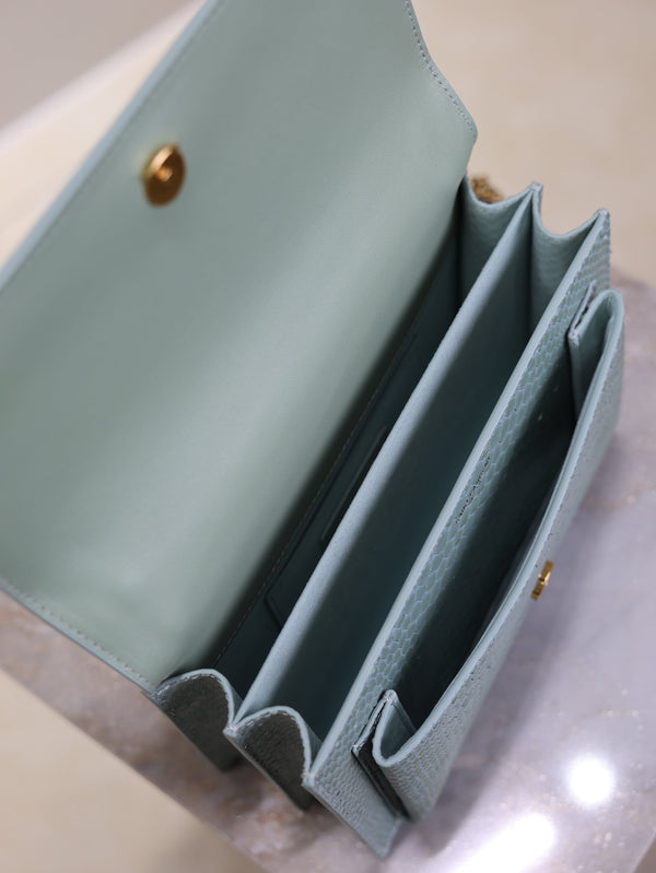 Borsa a tracolla YSL Sunset media da 22 cm in pelle con motivo pitone blu grigiastro