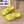 POOL GRAFFITI CROCS SLIDE SANDALS IN YELLOW AND BLACK RUBBER