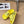 POOL GRAFFITI CROCS SLIDE SANDALS IN YELLOW AND BLACK RUBBER