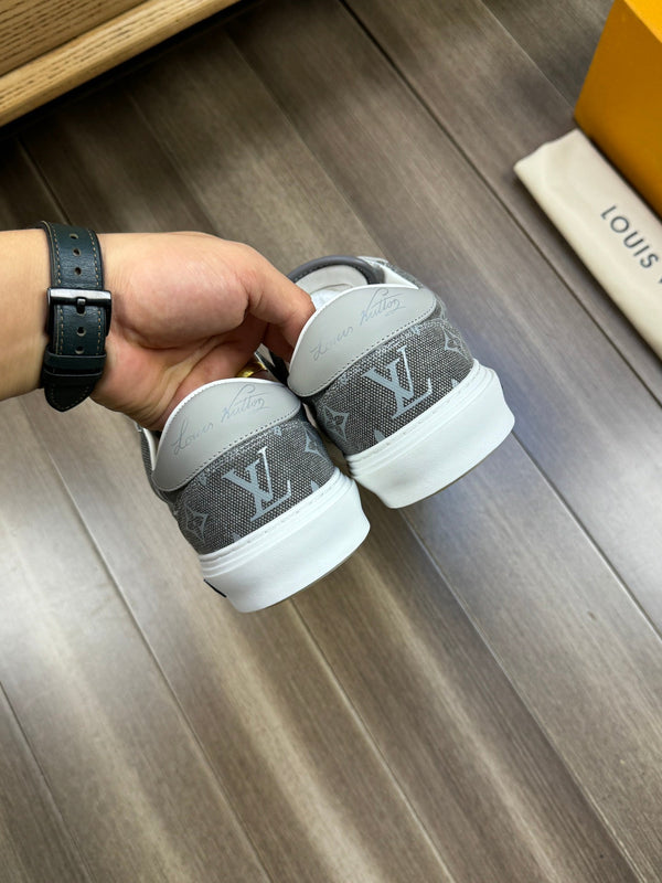 LV TRAINER SNEAKER IN GREY PASTEL MONOGRAM DENIM