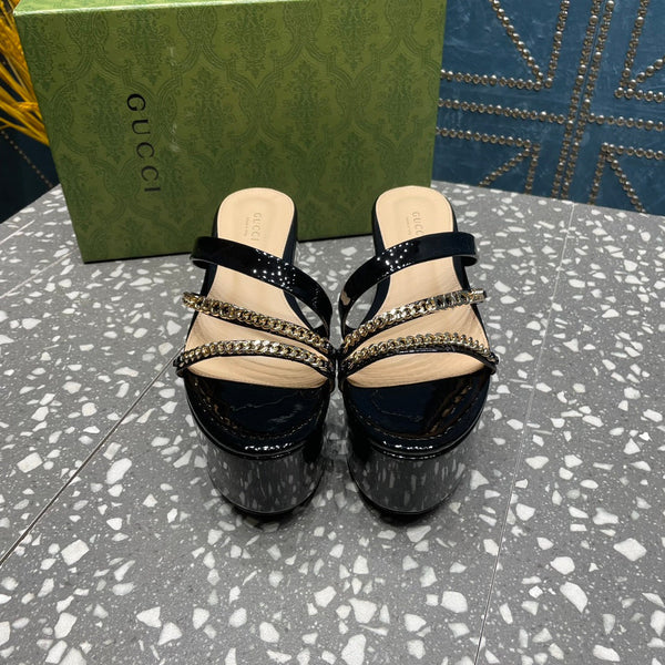 HIGH WEDGE PLATFORM IN BLACK CALFSKIN WITH GOLD HARDWARE