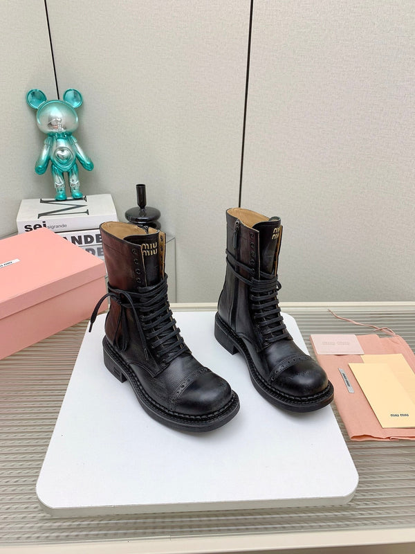 Stivaletti Miu in pelle con lacci in vacchetta nera