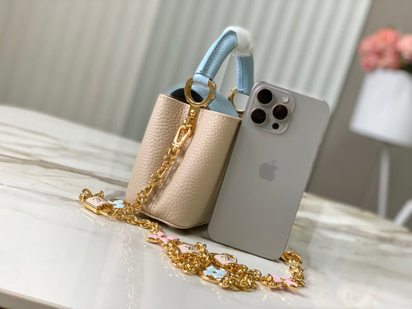 capucines nano 16 beige cloud blue taurrilon leather gold hardware