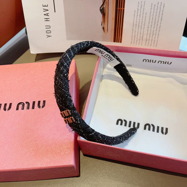 CERCHIETTO IN TWEED NERO CON LOGO ORO 157215