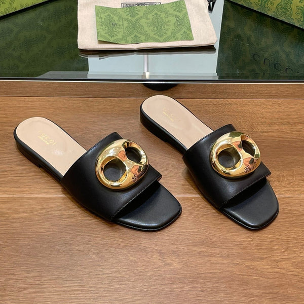 FLAT MULE IN BLACK CALFSKIN