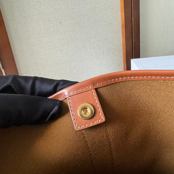 BUCKET 30 IN BEIGE TRIOMPHE CANVAS AND RED BROWN CALFSKIN TRIM