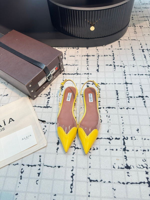 ALAIA FLAT SLINGBACK IN YELLOW PATENT CALFSKIN AND FILM