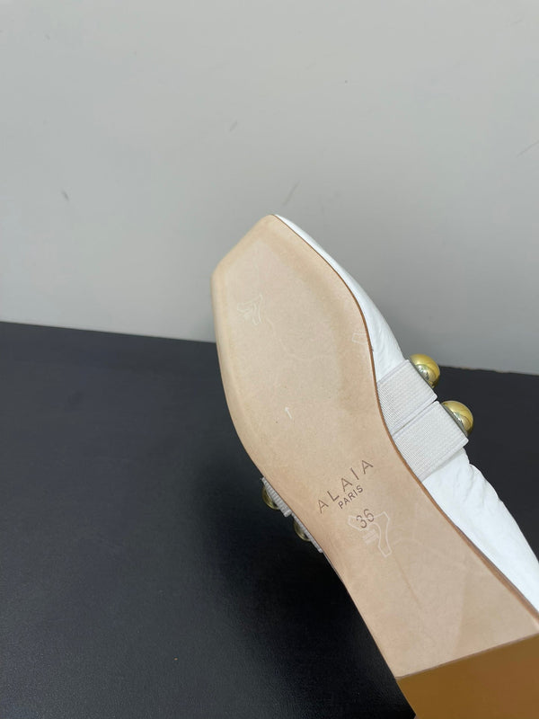 ALAIA BALLET FLATS IN WHITE GLOSSY CALFSKIN WITH GOLD HARDWARE