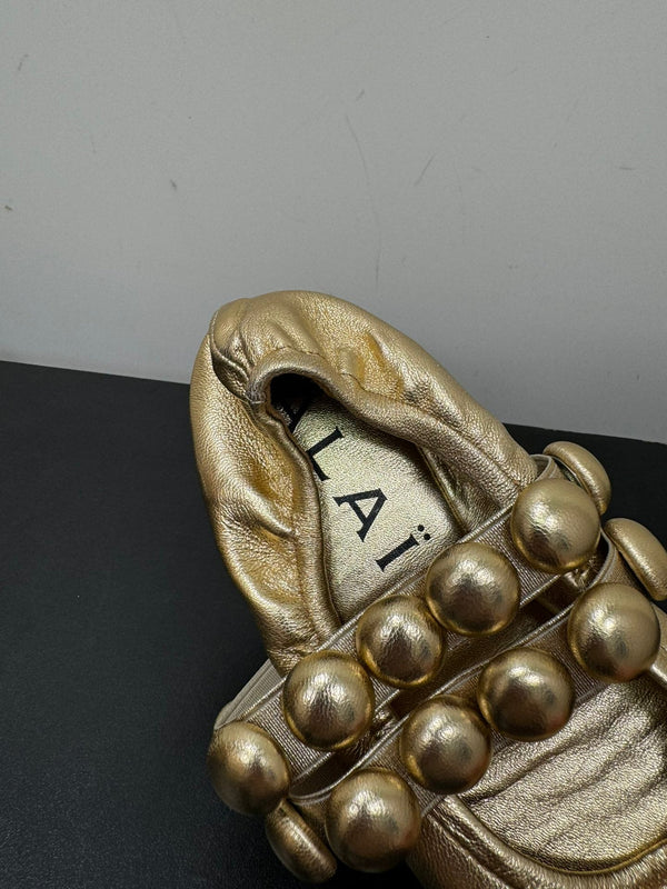 ALAIA SPHERE BALLET FLATS IN GOLDEN LAMBSKIN
