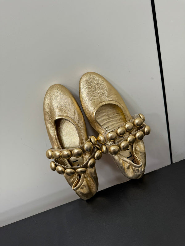ALAIA SPHERE BALLET FLATS IN GOLDEN LAMBSKIN