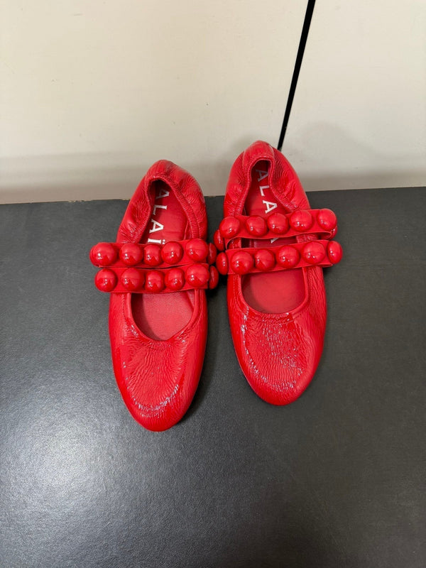 ALAIA SPHERE BALLET FLATS IN CHERRY RED LAMBSKIN